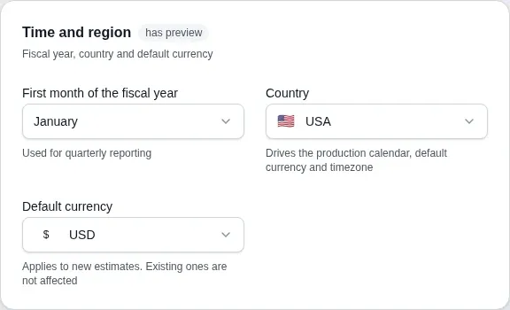 The Time & region section of the workspace settings: first month of the fiscal year, the Country field set to KZ and the Default currency field set to KZT